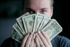 person fanning money