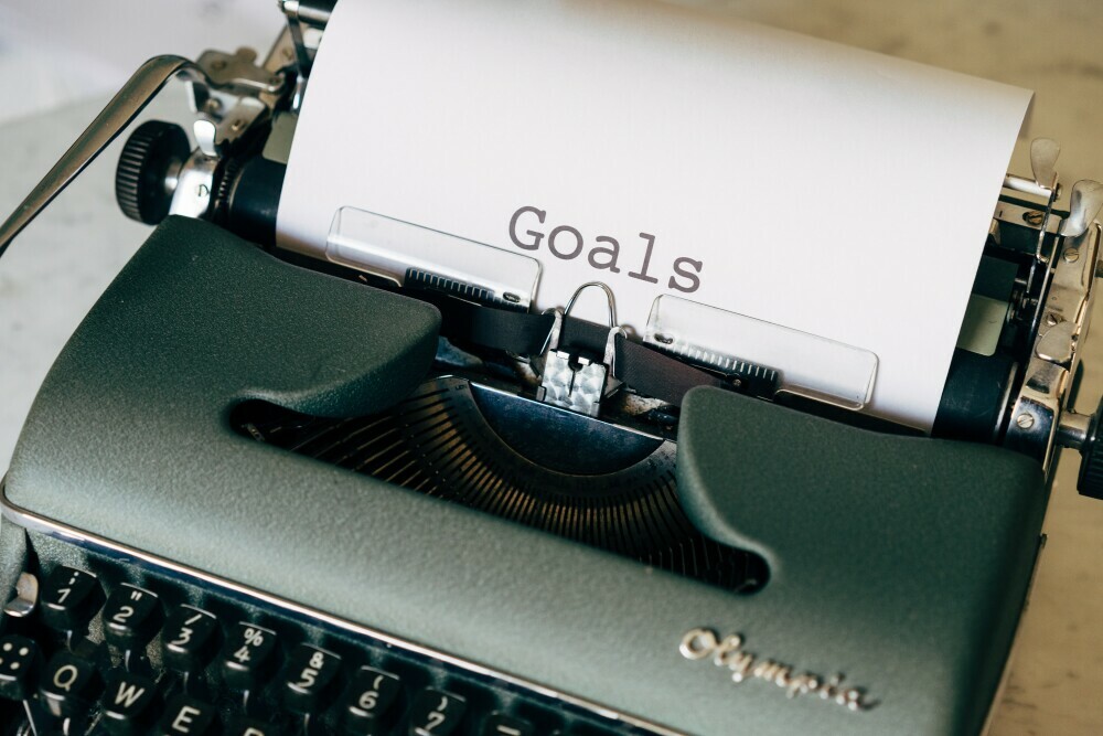 typewriter and page of "goals"